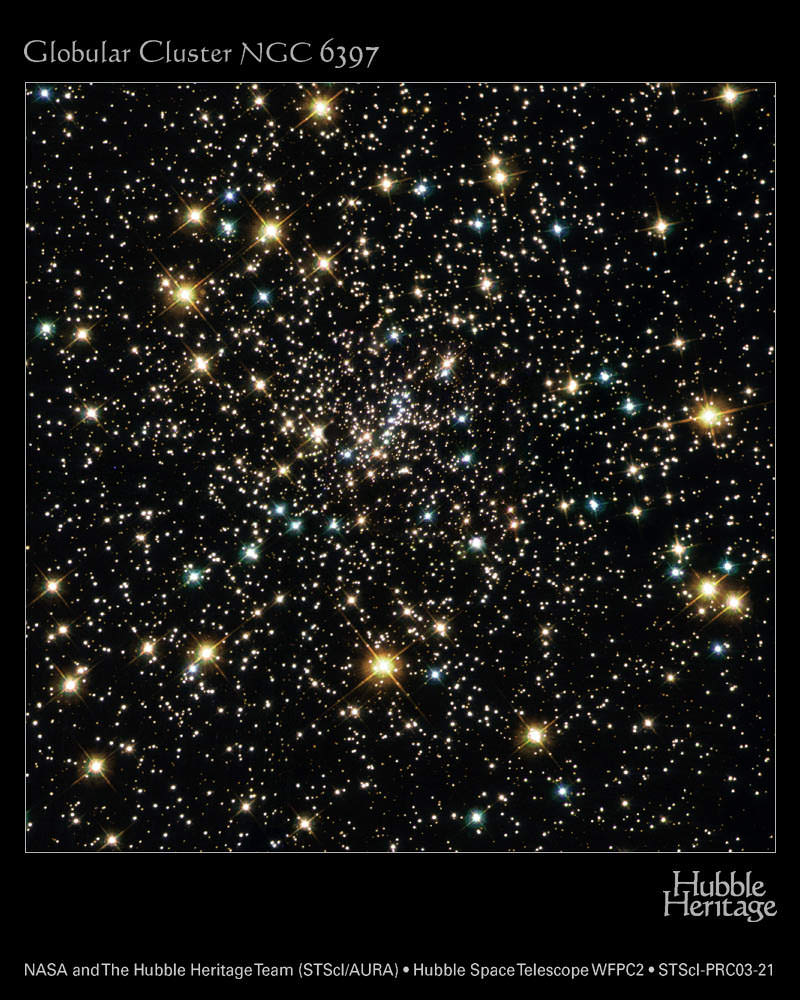 The globular cluster NGC 6397 glitters with the light from hundreds of thousands of stars in this Hubble Space Telescope image. The blue stars are massive stars near the end of their lives, and the red stars are stars that have burned most of their hydrogen and are now red giants. The small white objects include stars like our Sun. Image Credit: NASA, ESA, Tom M. Brown (STScI), Stefano Casertano (STScI), Jay Anderson (STScI)