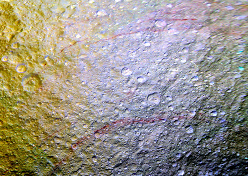 What Are These Strange Scarlet Streaks Spotted on Tethys?