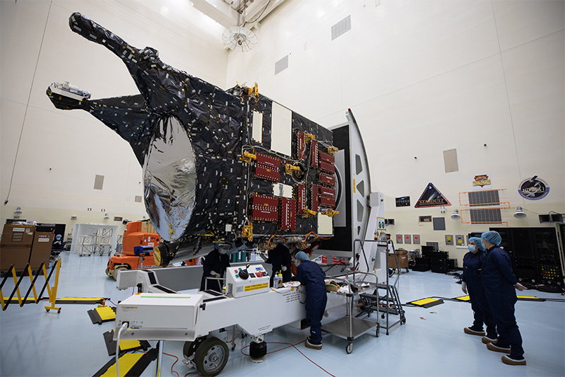 The Psyche spacecraft is currently at the Kennedy Space Center in the Payload Hazardous Servicing Facility. Technicians were preparing it for launch, but now it's on hold. Image Credit: NASA/Isaac Watson