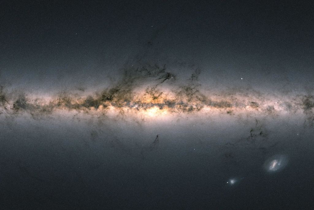 Gaia's map of the Milky Way has become iconic. This image is constructed from Gaia data that's mapping two billion of the galaxy's stars. It also mapped stars in the Large and Small Magellanic clouds. Image Credit: ESA/Gaia/DPAC