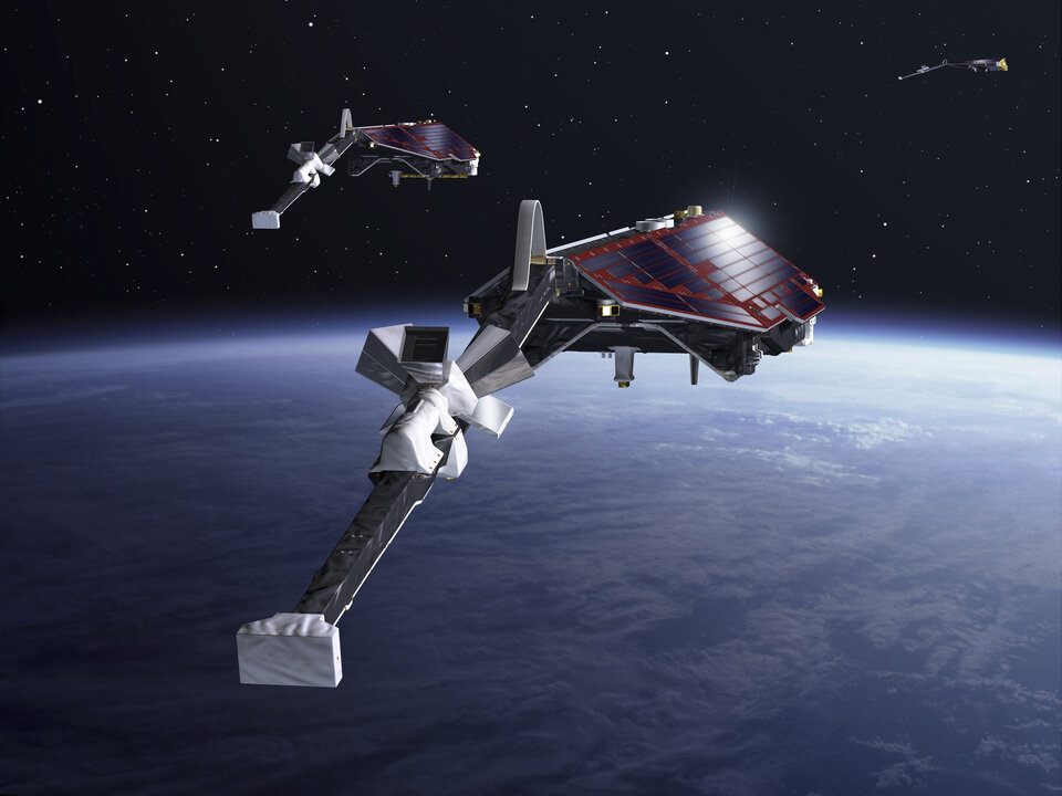 Artist's depiction of Swarm is in its multi-satellite configuration.